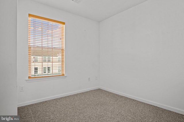 unfurnished room with carpet