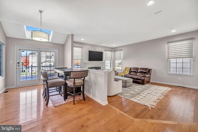 living room with light hardwood / wood-style floors