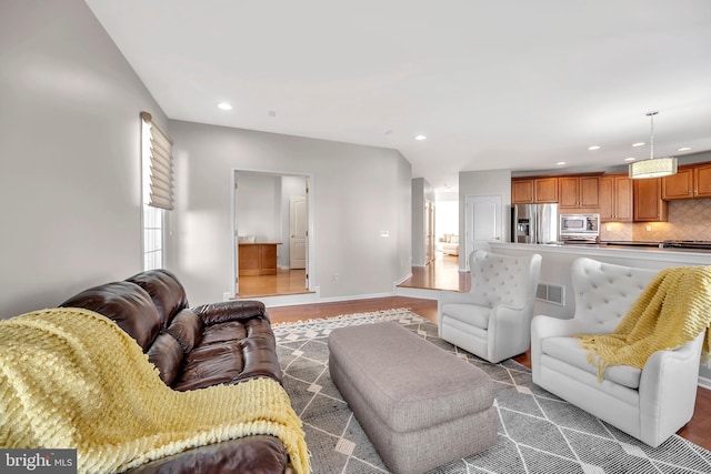 living room with dark hardwood / wood-style flooring