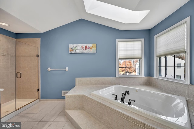 bathroom with vaulted ceiling with skylight, tile patterned floors, and plus walk in shower