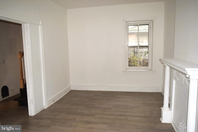 spare room featuring dark hardwood / wood-style flooring