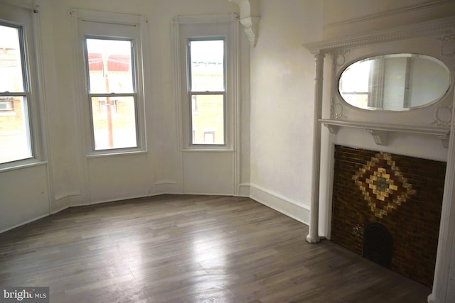 unfurnished living room featuring wood-type flooring