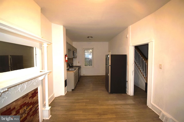 corridor featuring dark hardwood / wood-style floors