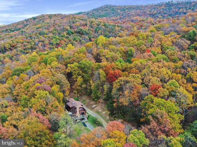 831 Stephens Ln, Fort Valley, VA 22652 - aerial view of property and surrounding area featuring a heavily wooded area and a mountainous background