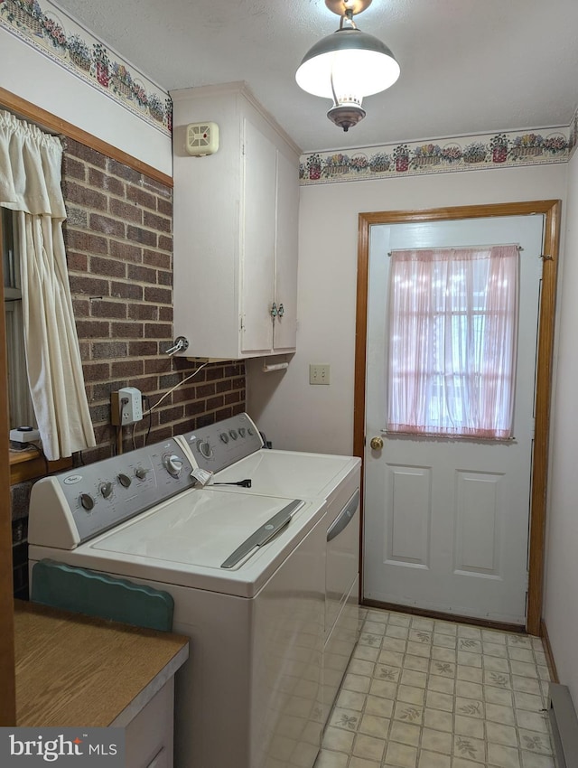 laundry area with cabinets and washer and dryer