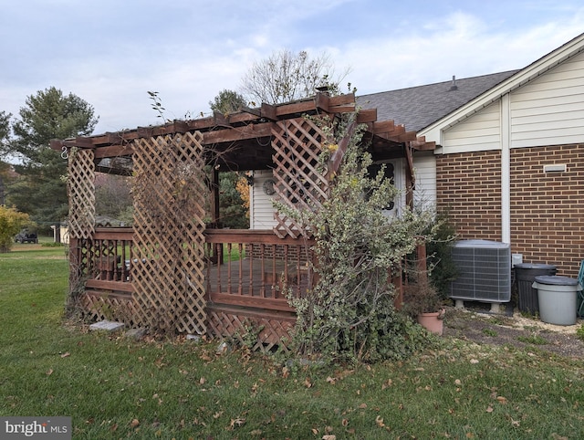 exterior space with a wooden deck, cooling unit, and a pergola