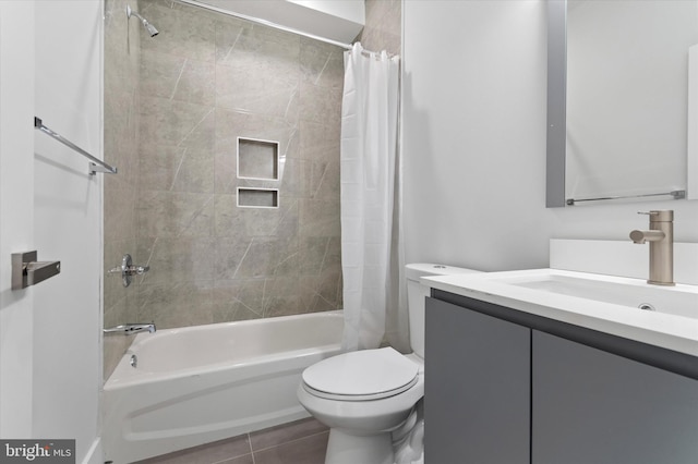 full bathroom with tile patterned flooring, vanity, shower / bath combination with curtain, and toilet