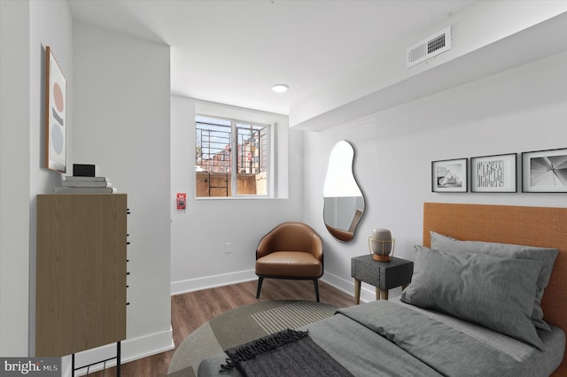 sitting room with hardwood / wood-style flooring