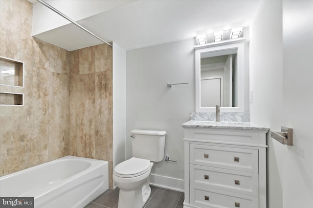 full bathroom featuring washtub / shower combination, tile patterned flooring, toilet, and vanity