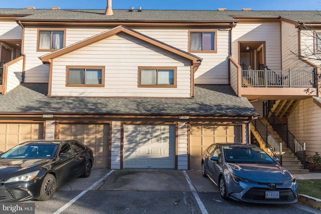 rear view of house with a garage