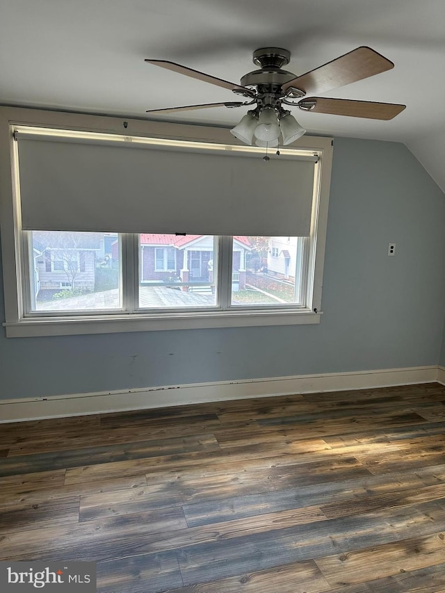 bonus room featuring dark hardwood / wood-style flooring, lofted ceiling, and ceiling fan