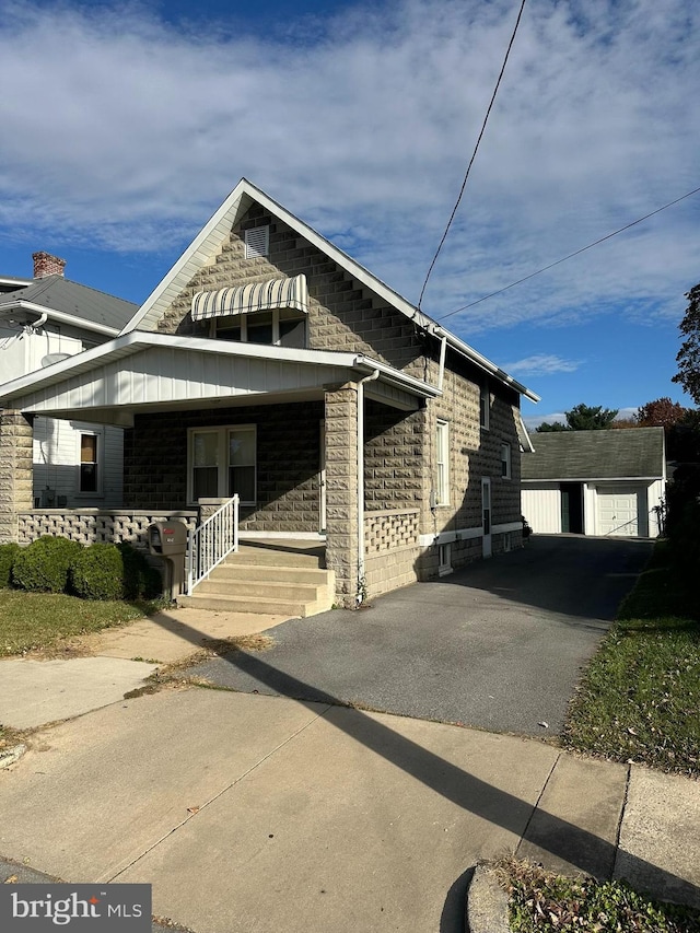 view of front facade with a carport and covered porch