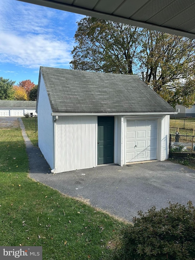 garage with a lawn