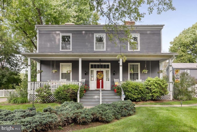 355 Orchard Dr, Mount Jackson, VA 22842 - view of front of home with covered porch, a chimney, and a front yard