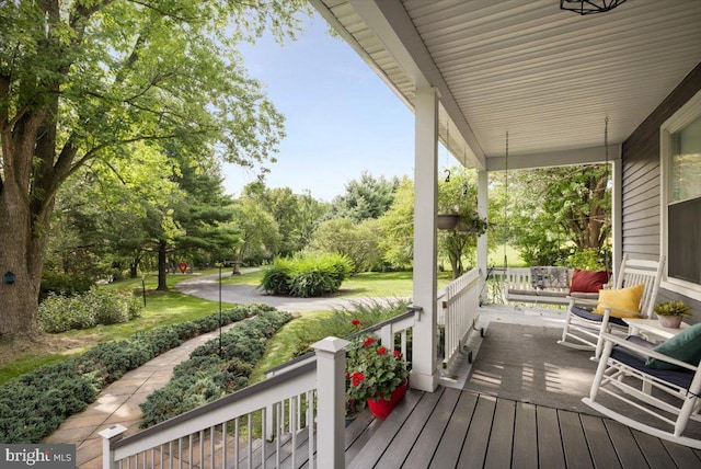 355 Orchard Dr, Mount Jackson, VA 22842 - wooden terrace featuring a porch and view of wooded area