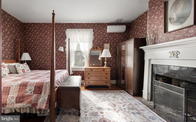 bedroom featuring a wall unit AC