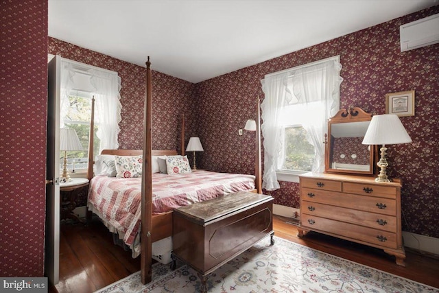 bedroom with hardwood / wood-style flooring