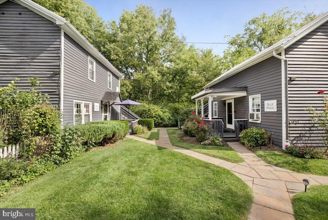 view of yard featuring a porch