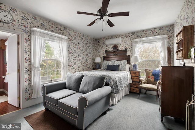 bedroom featuring ceiling fan, carpet floors, and a wall mounted AC