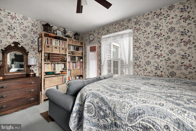 bedroom with ceiling fan and light colored carpet