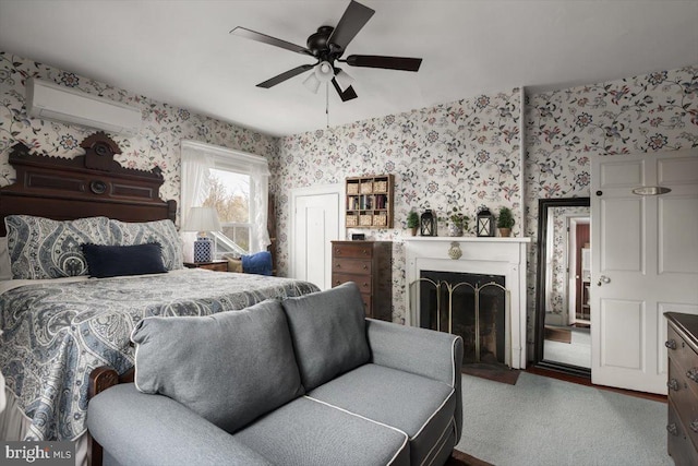 bedroom featuring carpet flooring, ceiling fan, and a wall mounted air conditioner