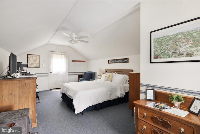 bedroom with dark colored carpet, ceiling fan, and vaulted ceiling