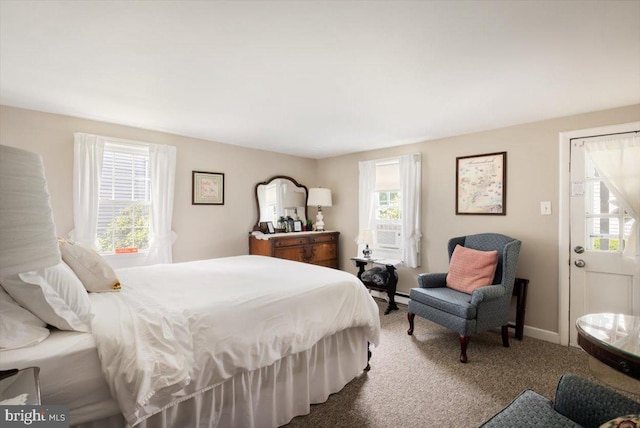 carpeted bedroom featuring a baseboard radiator