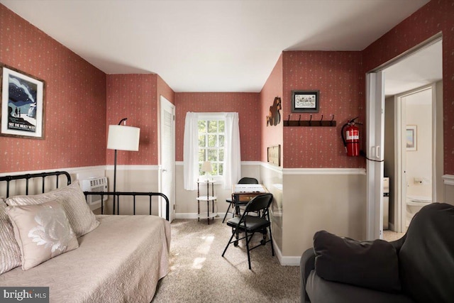 bedroom featuring light colored carpet