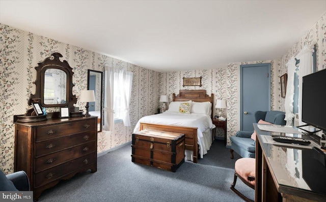 bedroom featuring dark colored carpet