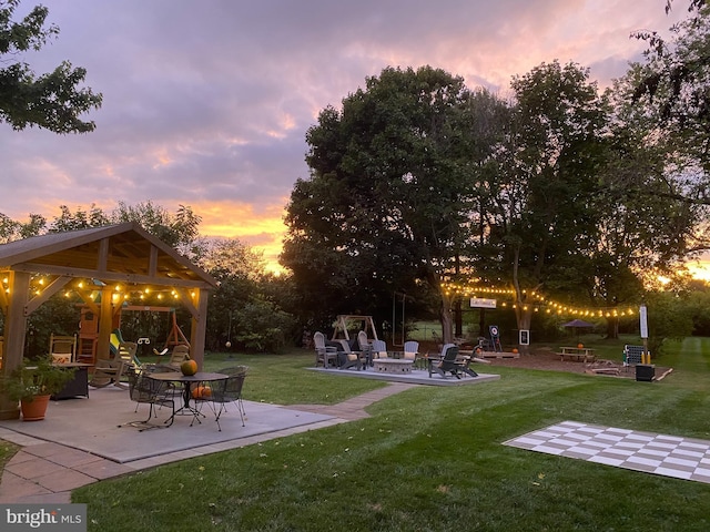355 Orchard Dr, Mount Jackson, VA 22842 - view of grassy yard with an outdoor fire pit, a patio area, a gazebo, and a playground
