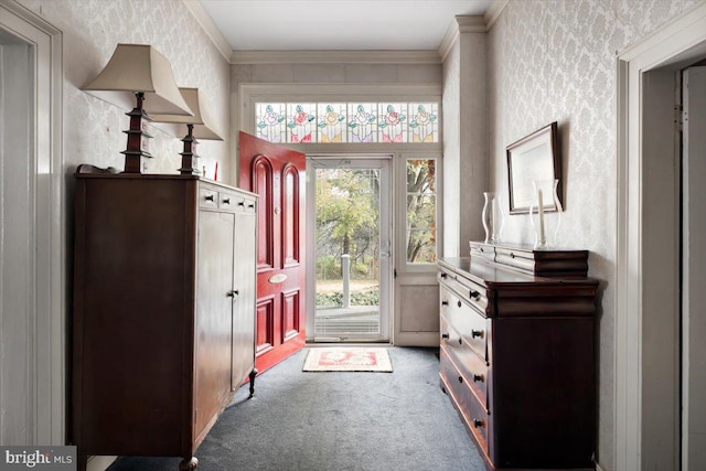 doorway featuring crown molding and carpet floors