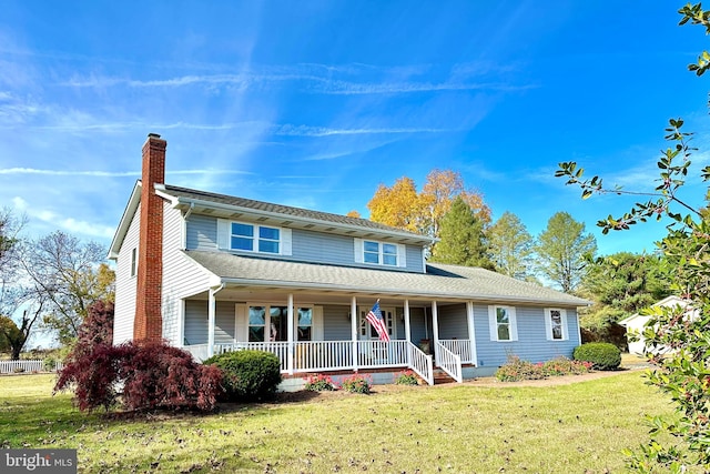 view of front of house featuring a porch and a front lawn