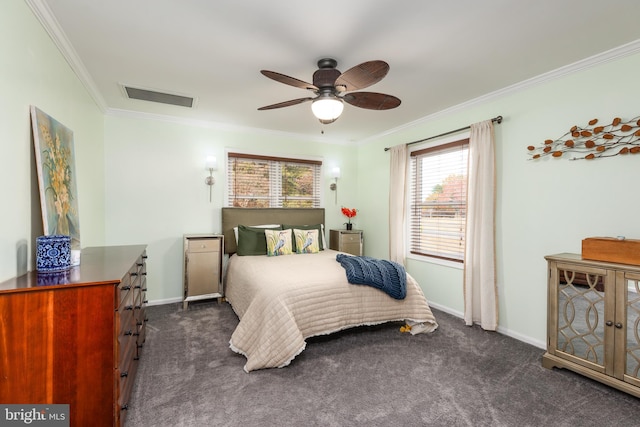 carpeted bedroom featuring ceiling fan and ornamental molding