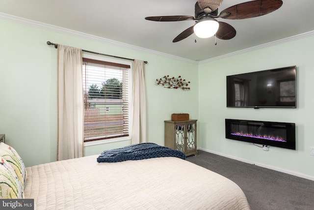 bedroom with dark colored carpet, ceiling fan, and crown molding