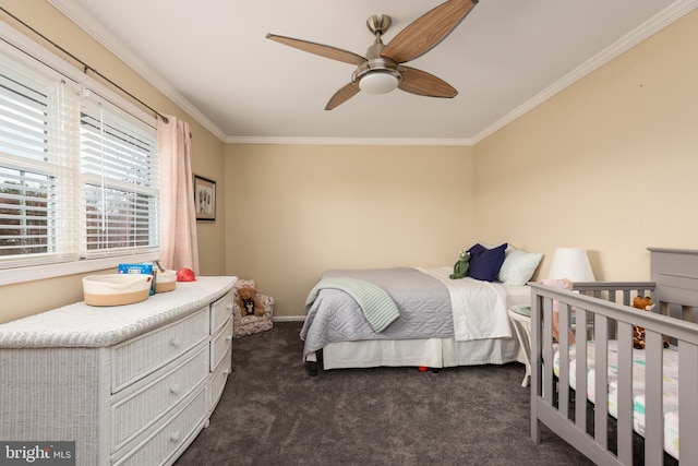 carpeted bedroom with ceiling fan and crown molding