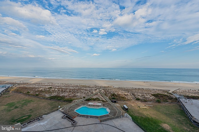 aerial view with a beach view and a water view