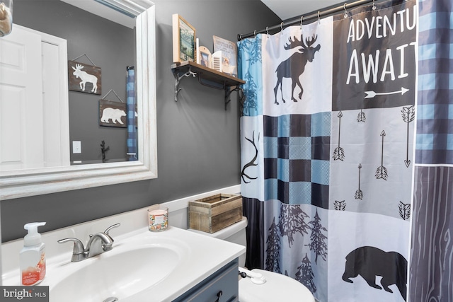 bathroom with vanity, toilet, and a shower with shower curtain