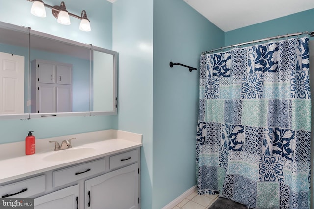 bathroom featuring tile patterned flooring, vanity, and a shower with shower curtain