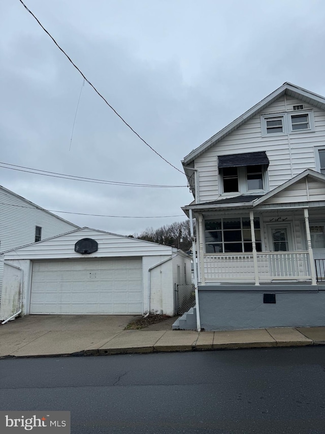 view of front of home with a garage and a porch