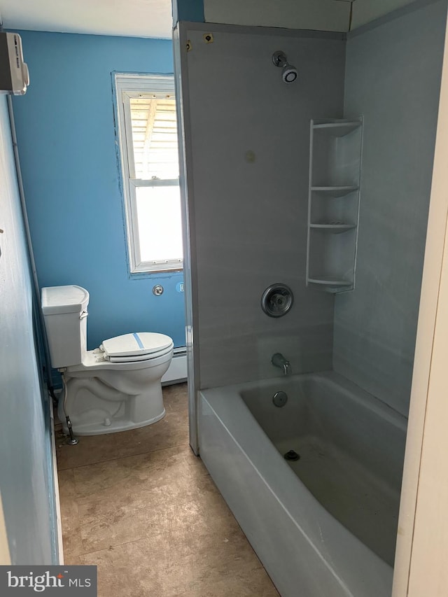 bathroom with toilet, tub / shower combination, and a baseboard radiator