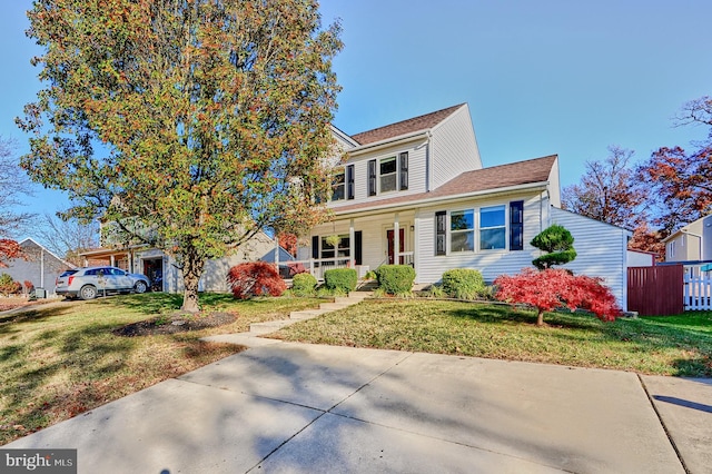 view of front of home with a front lawn and covered porch