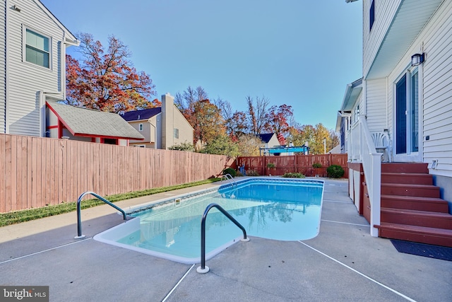 view of pool featuring a patio