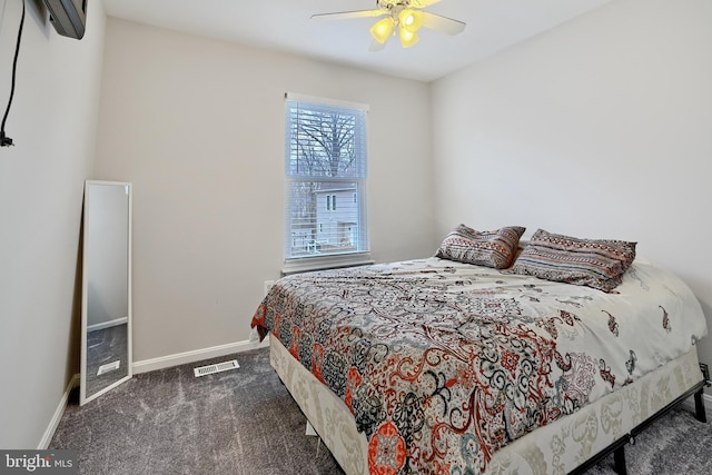 bedroom with dark colored carpet and ceiling fan