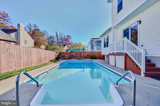 view of swimming pool with a patio area