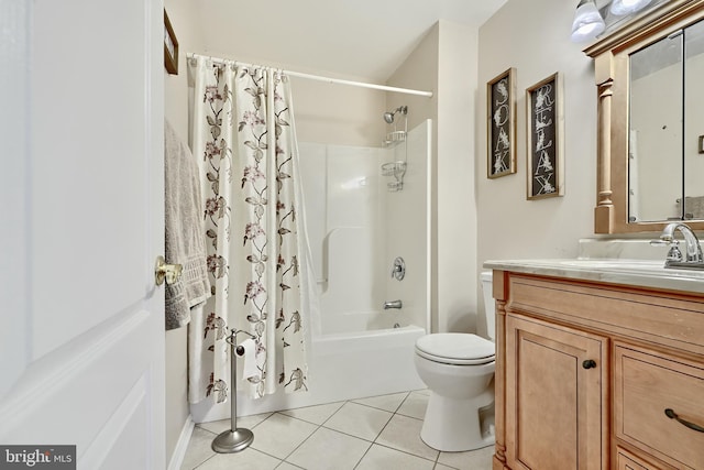 full bathroom with tile patterned floors, vanity, toilet, and shower / tub combo