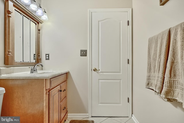 bathroom with tile patterned flooring and vanity