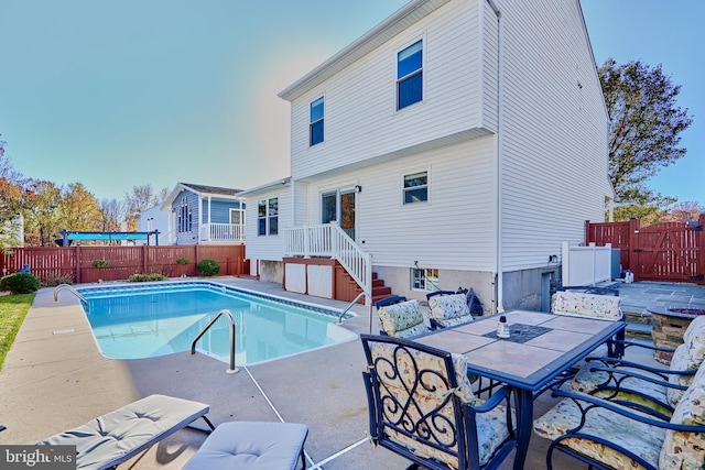 view of swimming pool with a patio