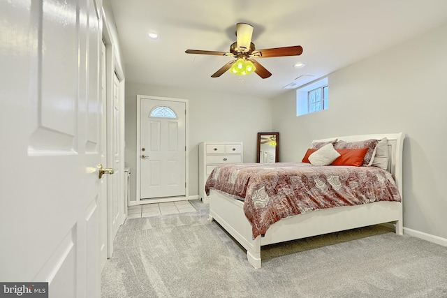 bedroom featuring light carpet and ceiling fan