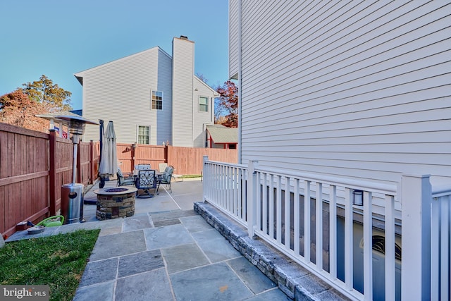 view of patio / terrace featuring a fire pit