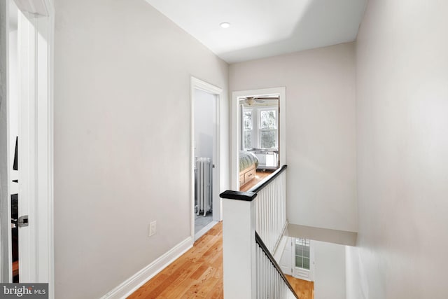 hall featuring radiator and light wood-type flooring